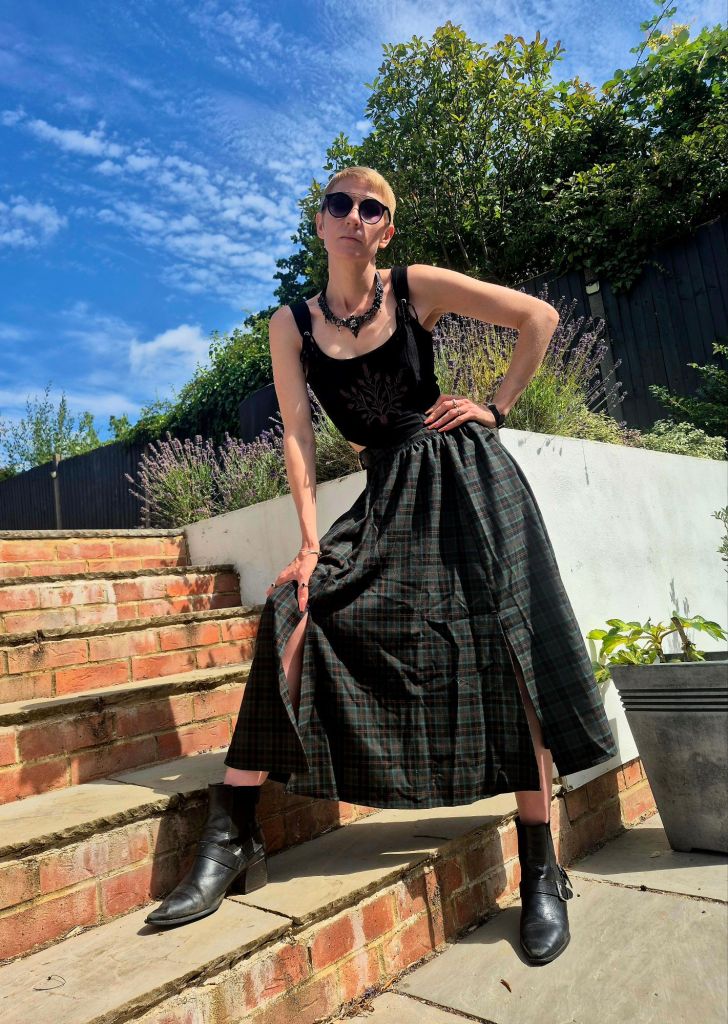 Jennifer Pierpoint wearing tartan long skirt and black velvet corset top.